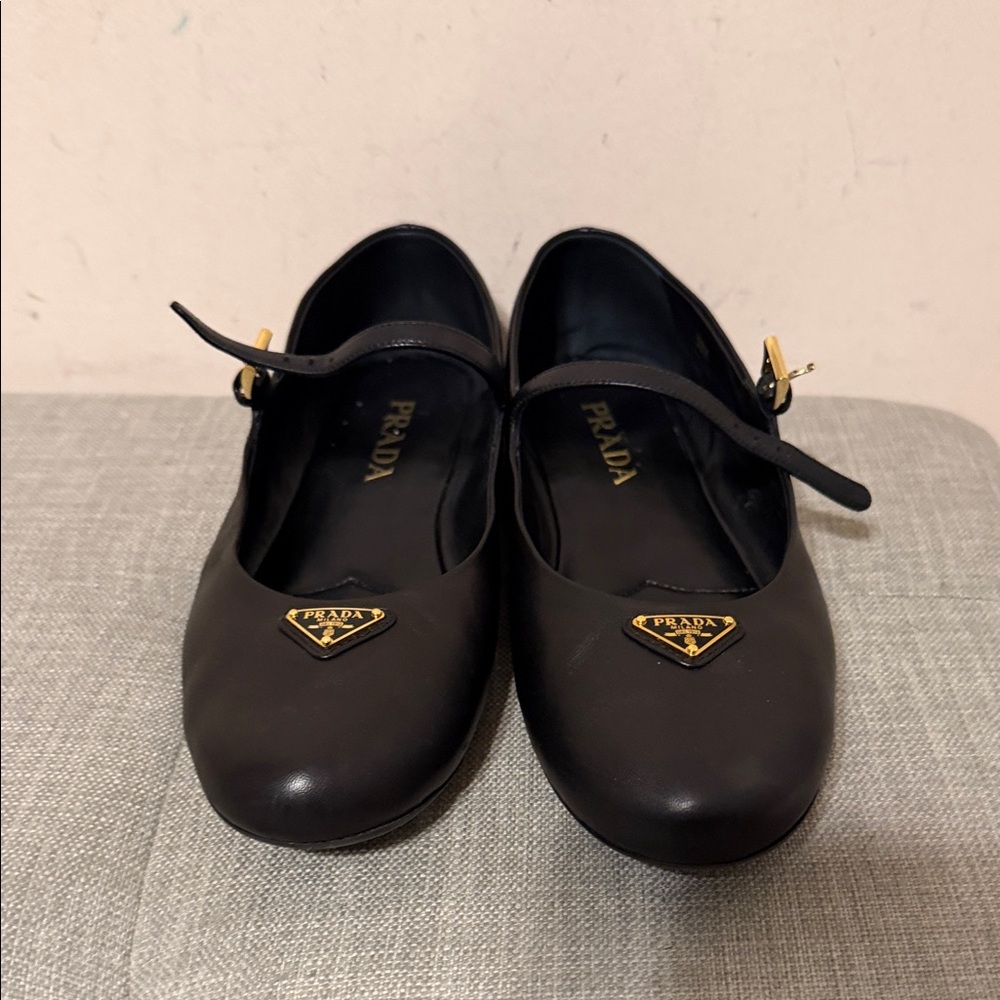 Prada Black Leather Flats with Gold Accents